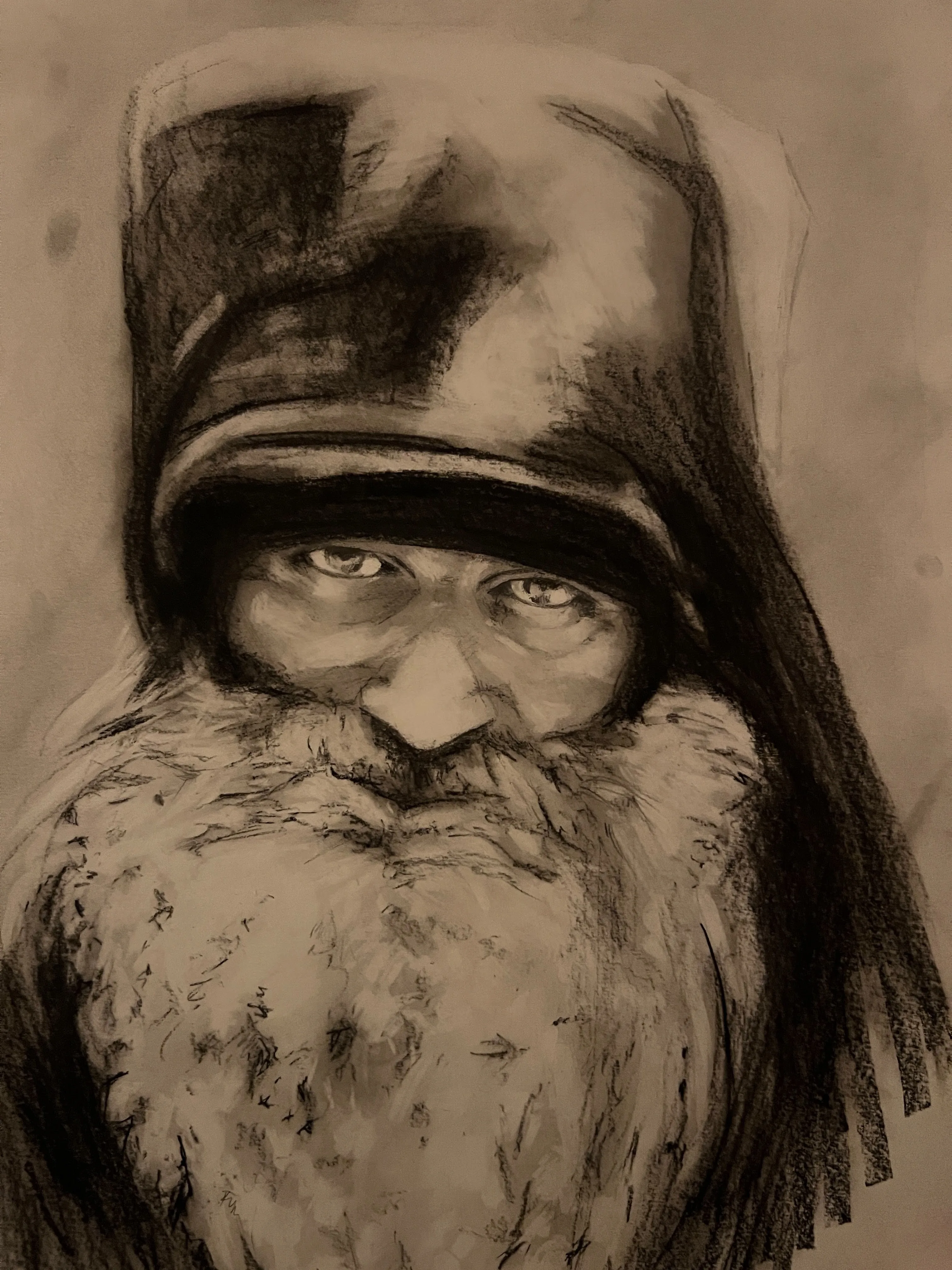Charcoal portrait of Hieromonk Seraphim Rose in a monastic klobuk, warm chiaroscuro on paper, by Clare Elise Lucia.