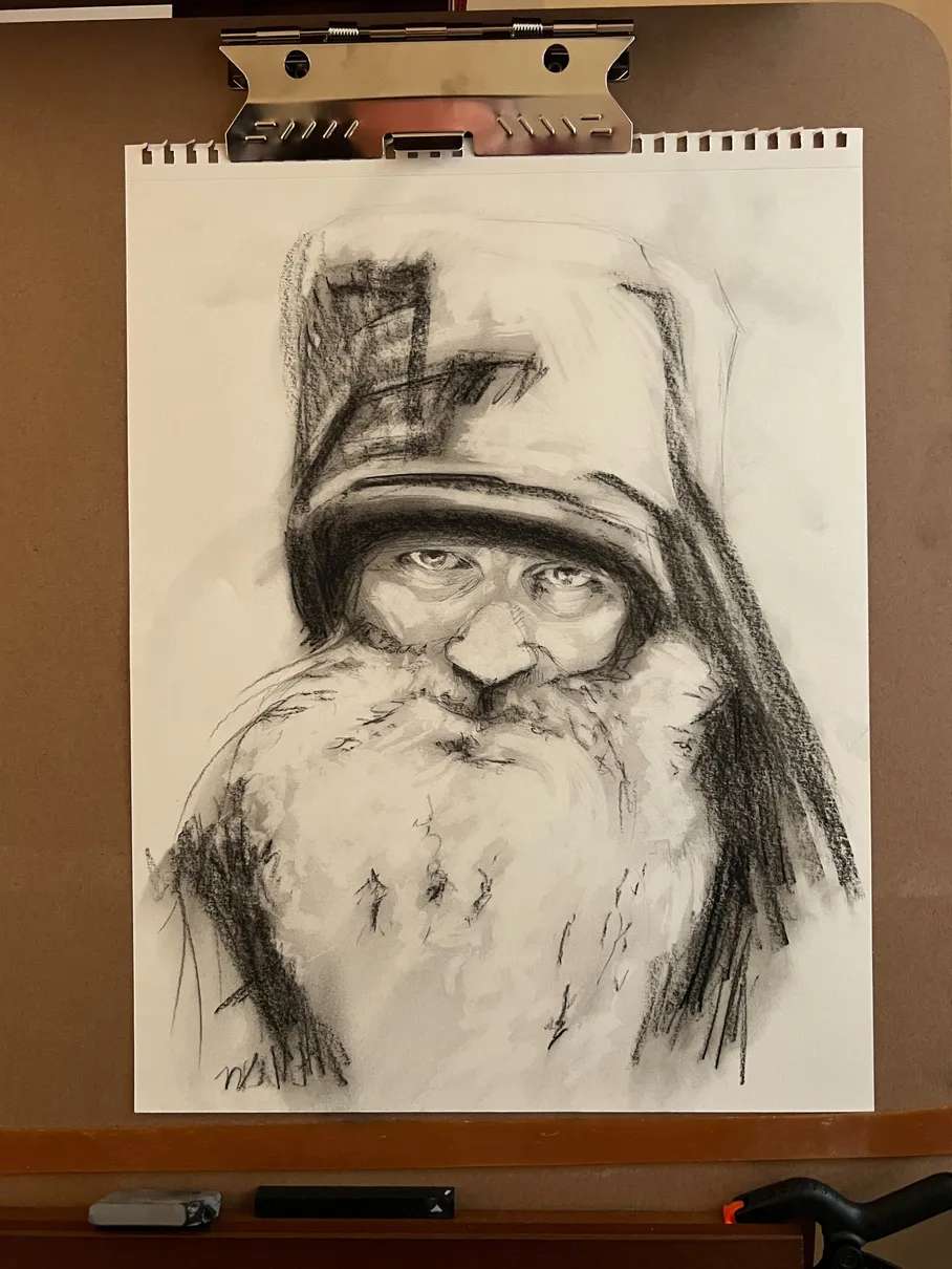 Early stage of the Seraphim Rose charcoal portrait on a large mounted surface.